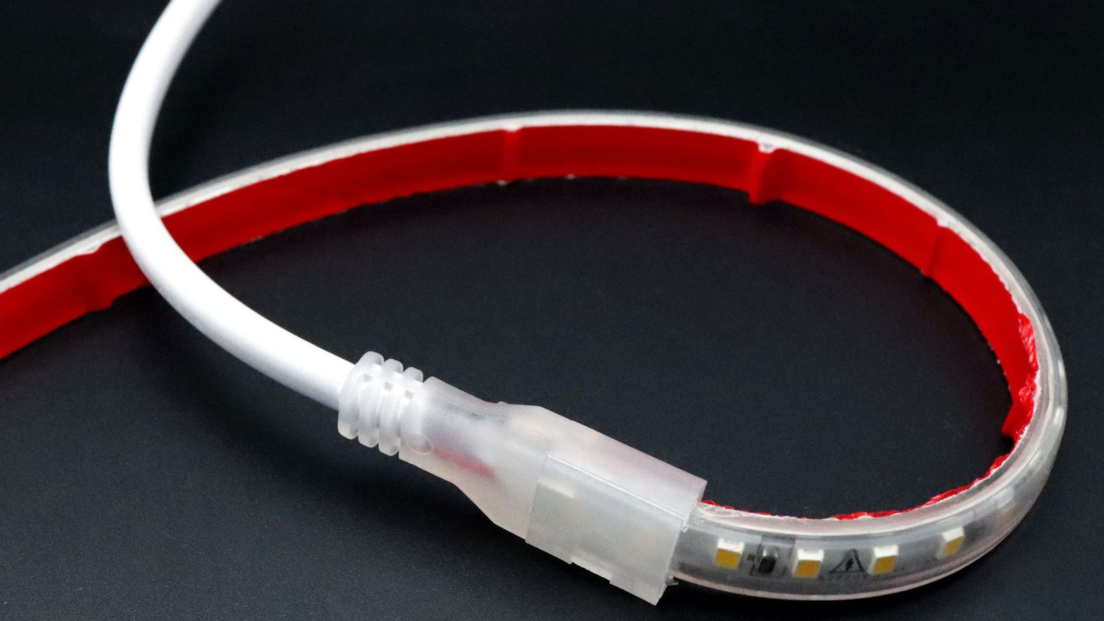 Close view of an LED strip end seated in a solderless connector