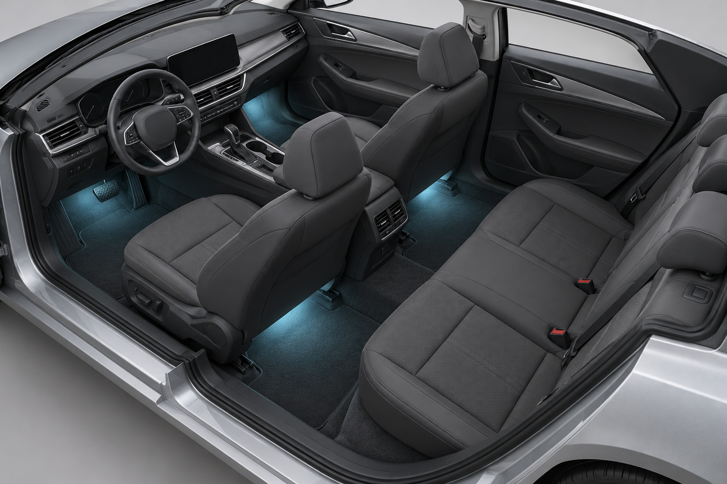 Elevated car-interior view showing front and rear footwell lighting positions