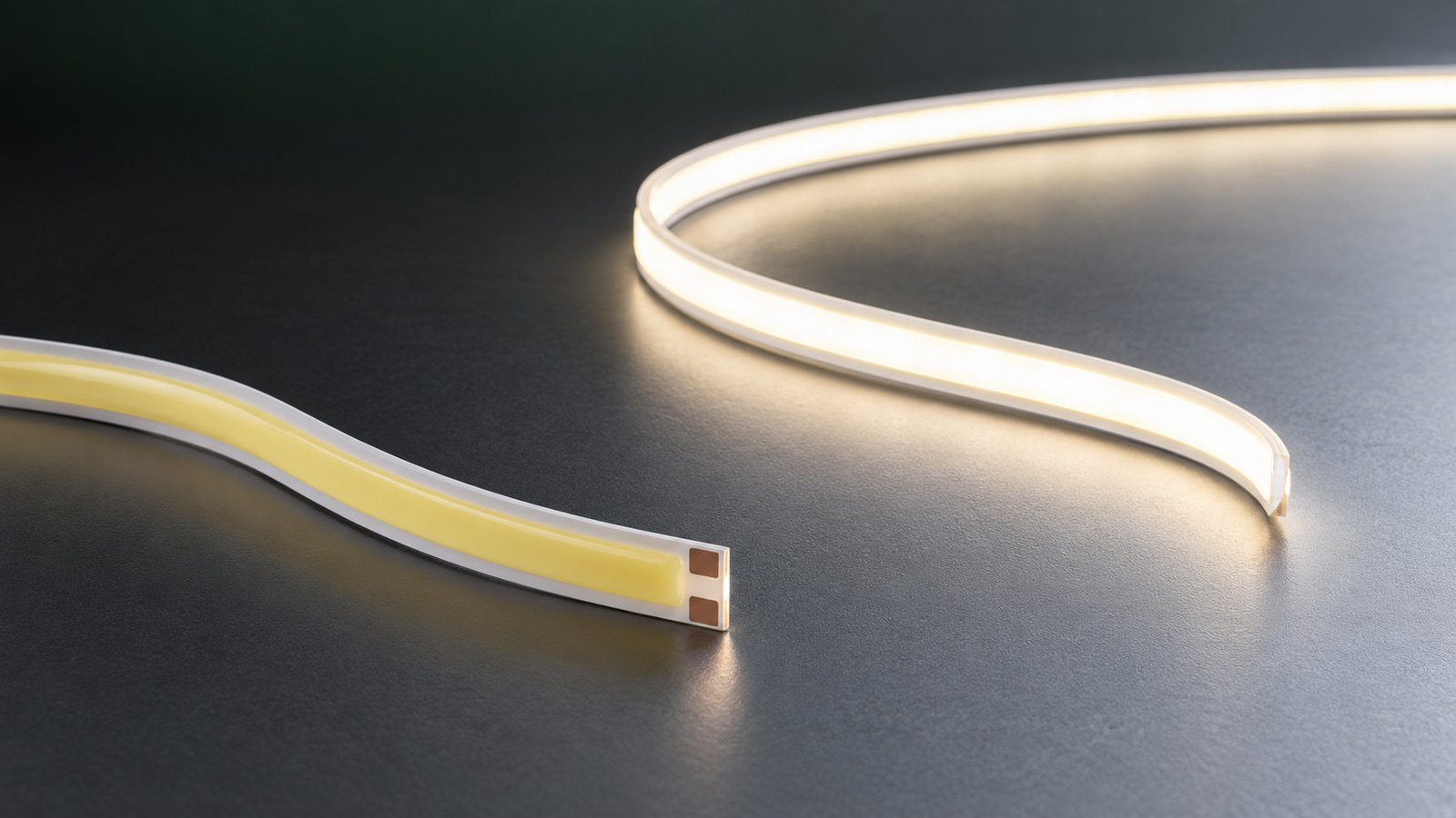 Lit and unlit COB LED strip sections on a dark surface.