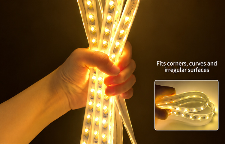 Hand holding a flexible encapsulated strip emitting warm-white light
