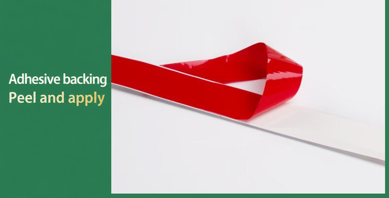 Red adhesive liner peeled from a flexible strip