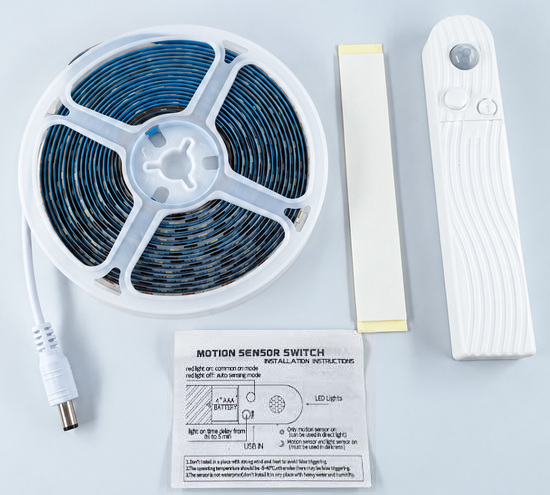 Strip reel with motion-sensor battery box, DC lead and adhesive pad