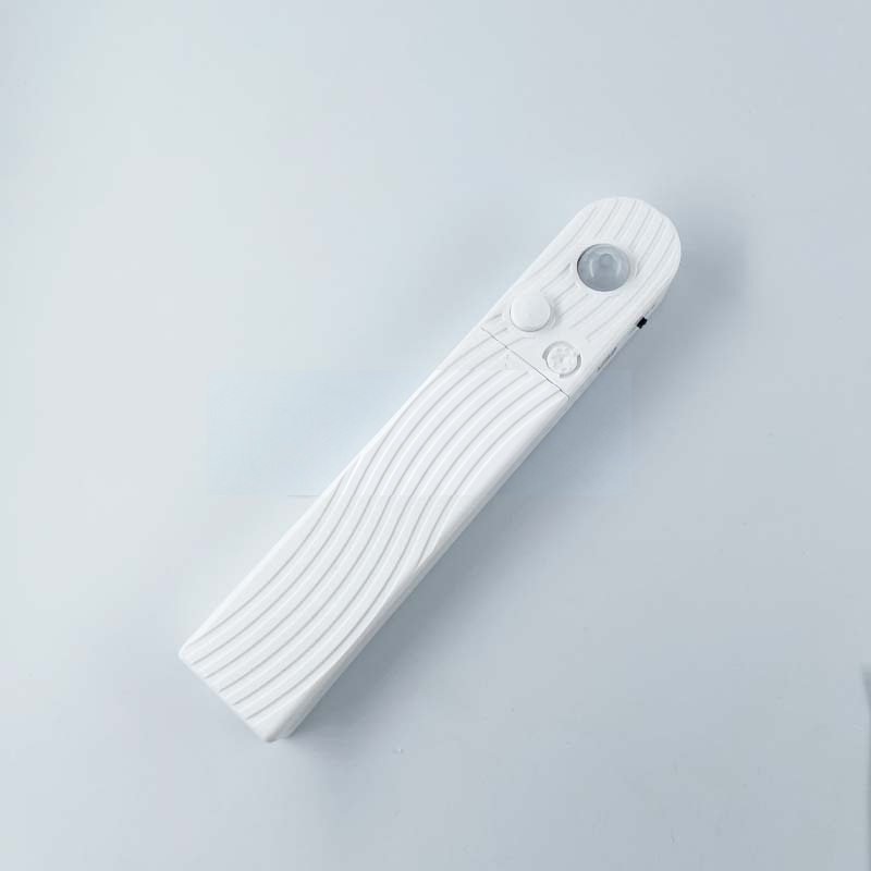White motion-sensor battery box with lens and adjustment controls