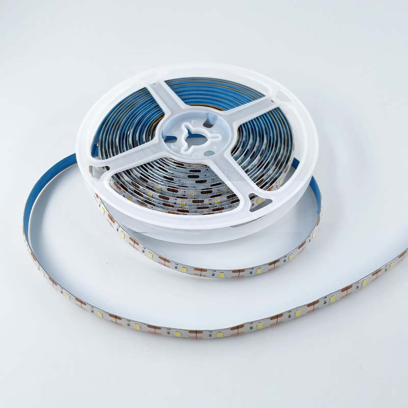 White strip reel with blue adhesive backing and visible LEDs