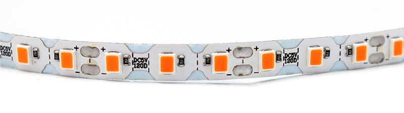 Curved S-shaped PCB with LEDs, resistors and solder pads.