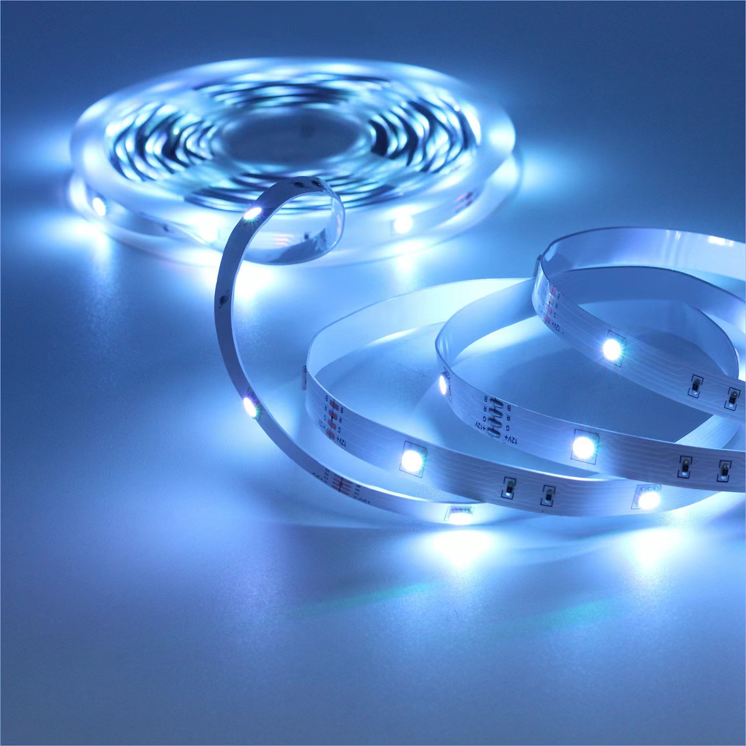 Blue light from a 12-volt RGB LED strip with visible solder pads