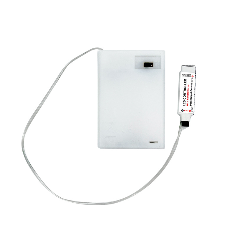 White battery box with an inline IR controller and connecting lead.