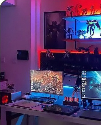 Colored LED accent lighting beside a computer display and display shelf.