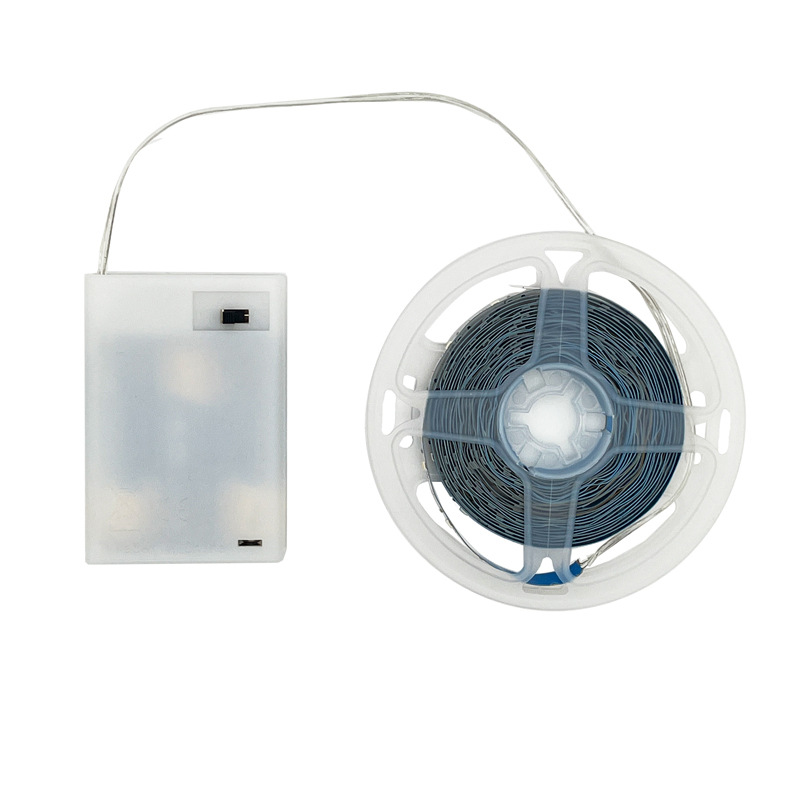 LED strip reel with a white battery box and slide switch.