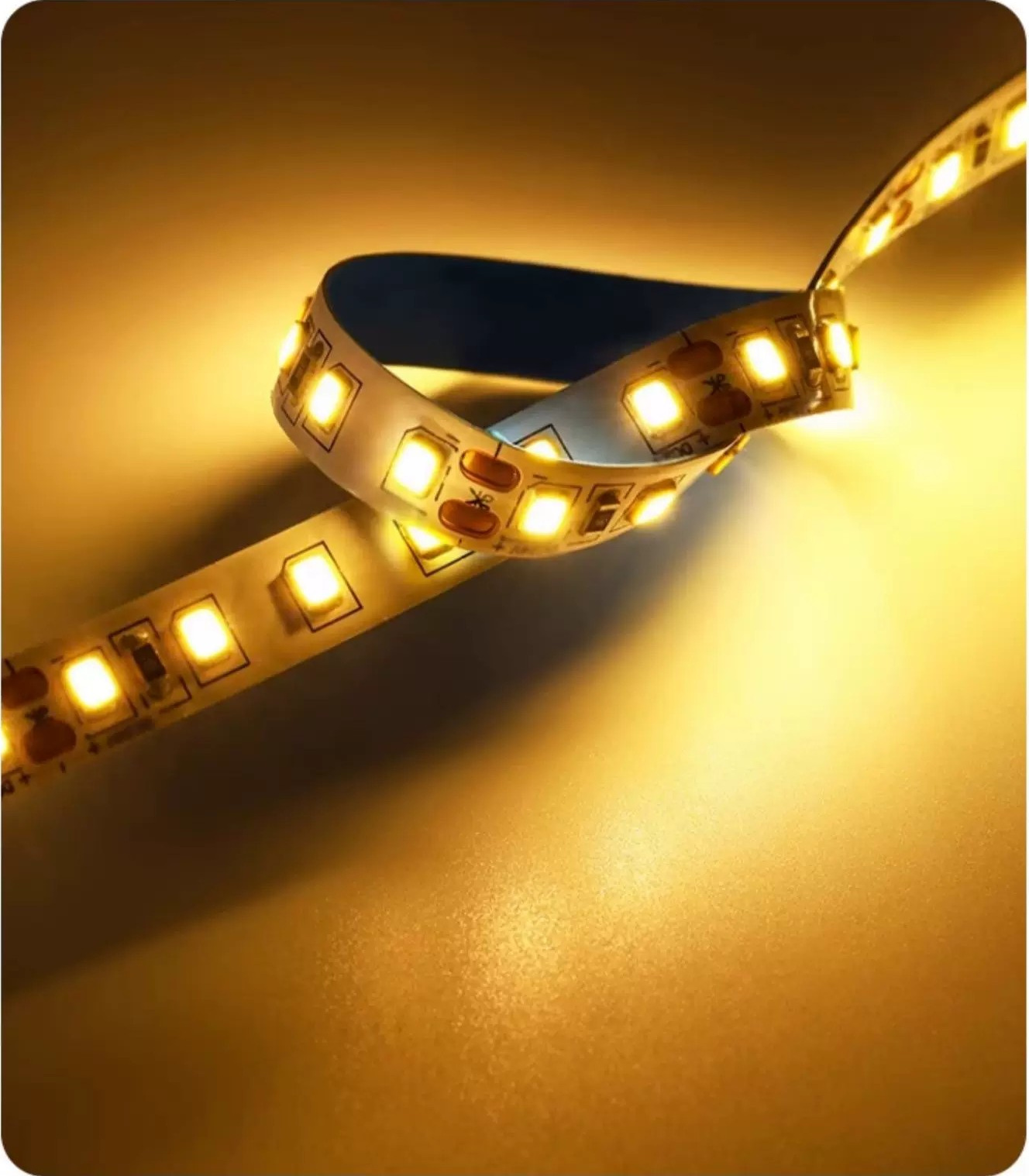 Warm-white LED strip with visible LED packages and solder pads