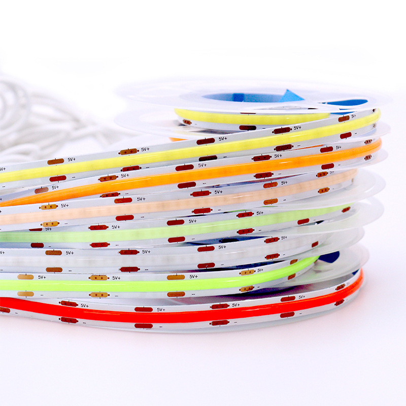 COB strips showing copper pads and continuous phosphor layers
