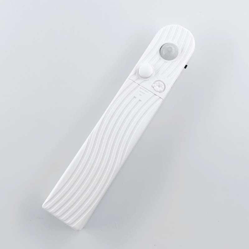 White PIR battery-box housing with sensor window, button and delay dial.