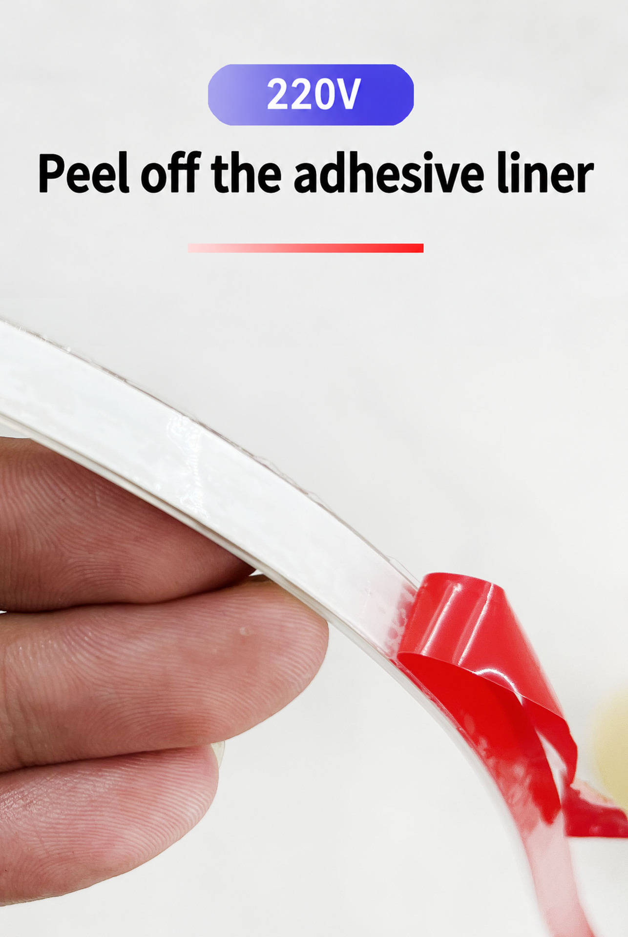 Red release liner peeled from the LED strip adhesive backing.