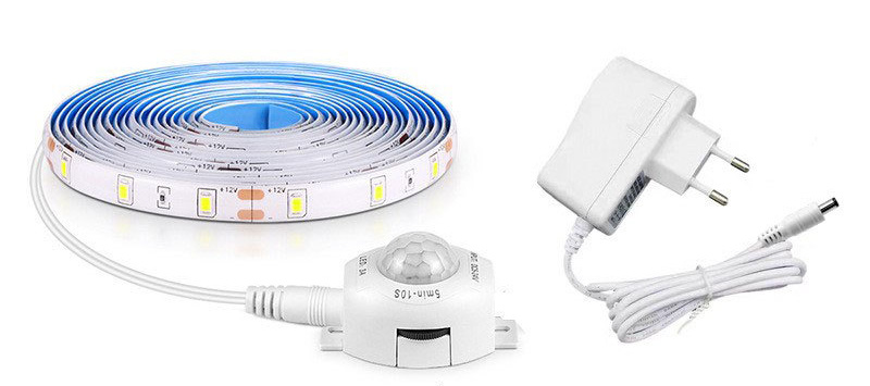 LED strip reel, PIR sensor and EU power adapter.