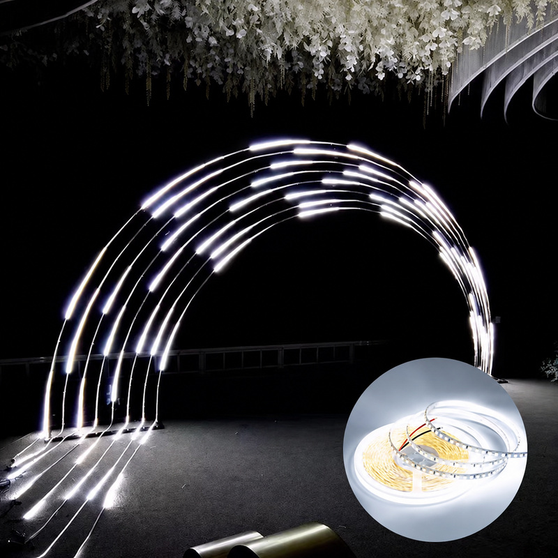 White chasing-light strips arranged around an event arch.
