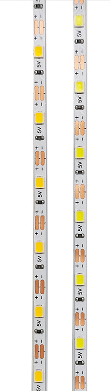 Two parallel samples of narrow LED strip showing cut pads.