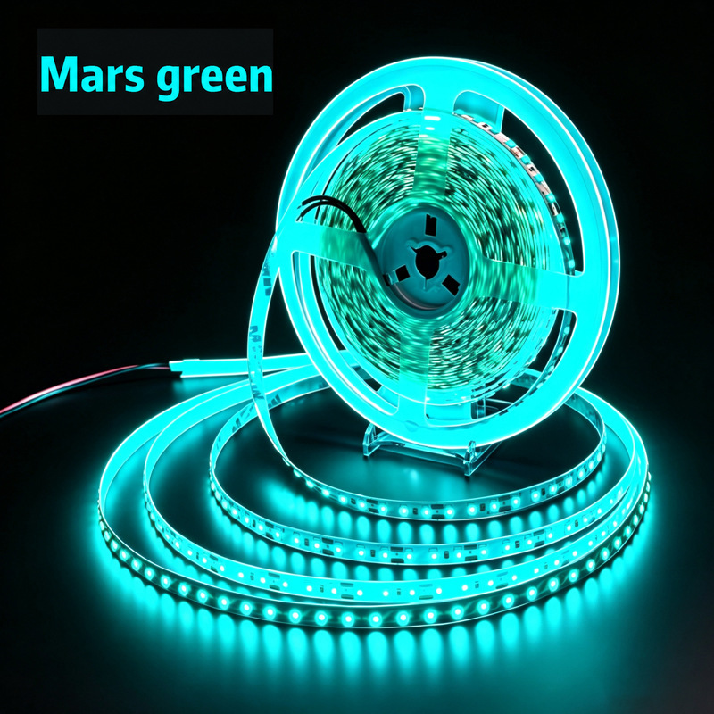 Mars-green LED strip illuminated on its reel.