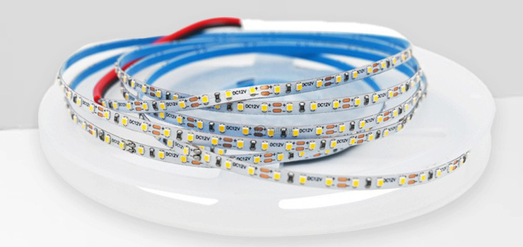 Narrow white LED strip with DC12V solder pads and blue backing.