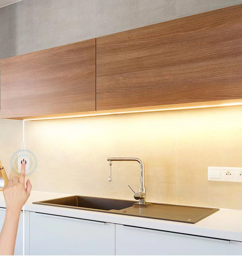 Warm-white lighting under kitchen cabinets.