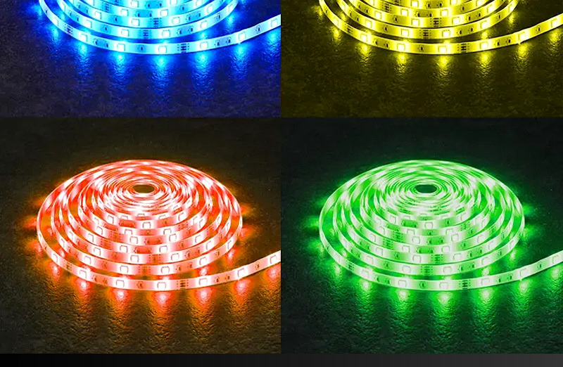 Addressable RGB LED strip reels lit in blue, yellow, red and green