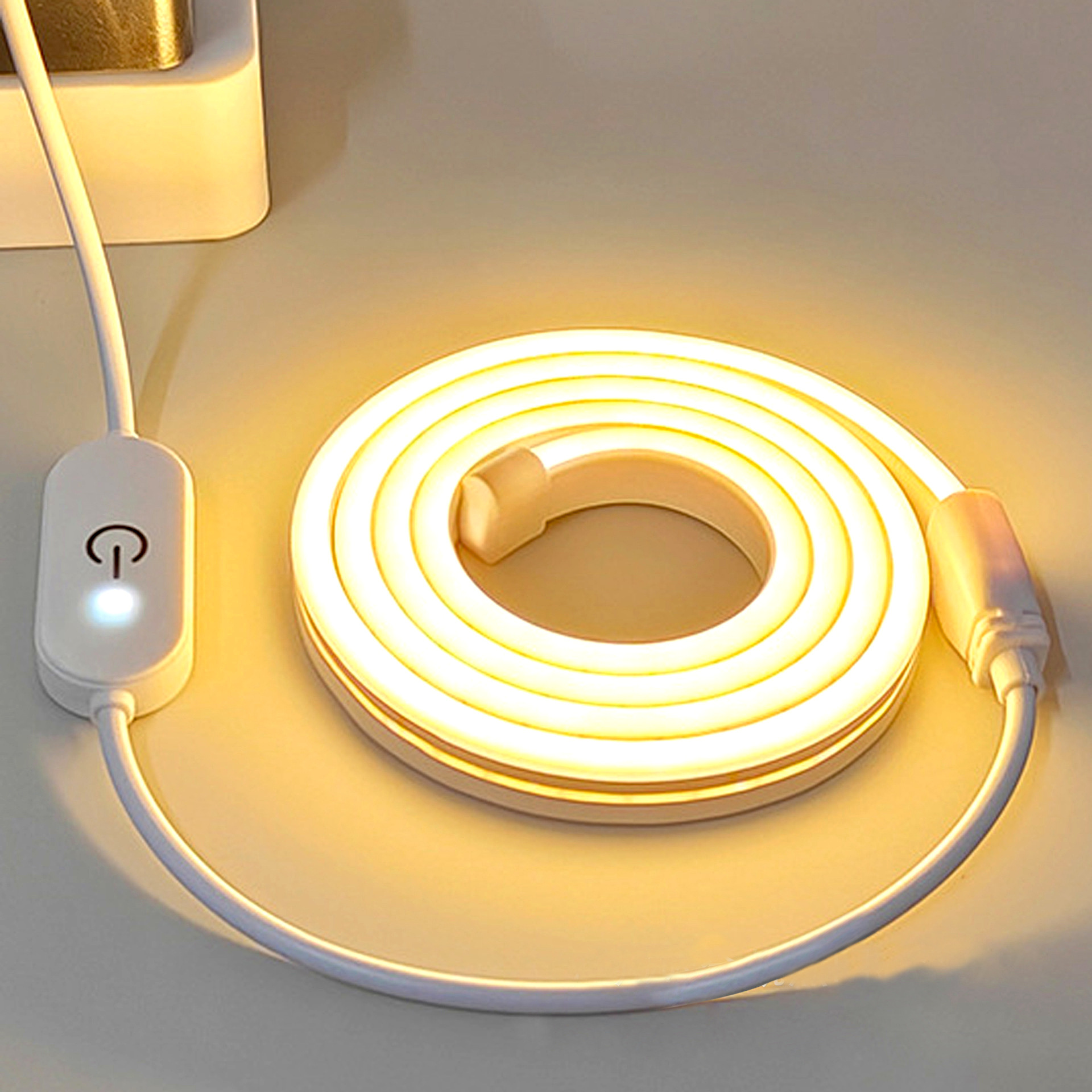 Warm-white flexible neon strip lit with an inline touch switch