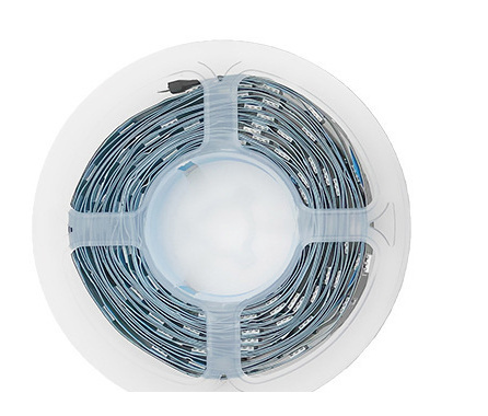 Tight product detail of the complete 3535 RGB strip reel; adjacent remote and packaging fragments are excluded