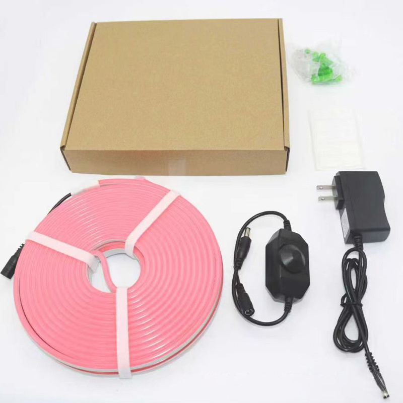 Pink rotary-dimmer kit contents with neon flex, adapter, clips and packing box