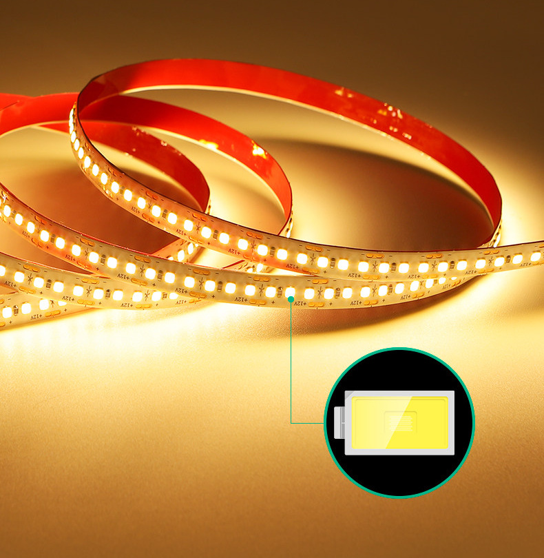 Warm-white 2835 flexible LED strip shown lit in loose coils