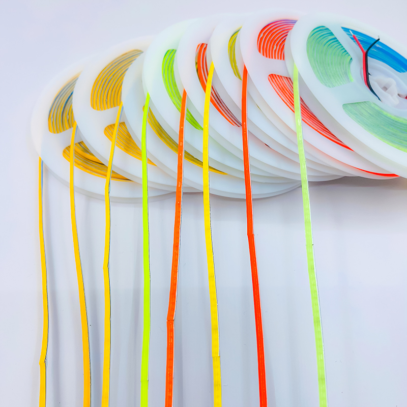 Several ultra-narrow colored COB strips extending from reels