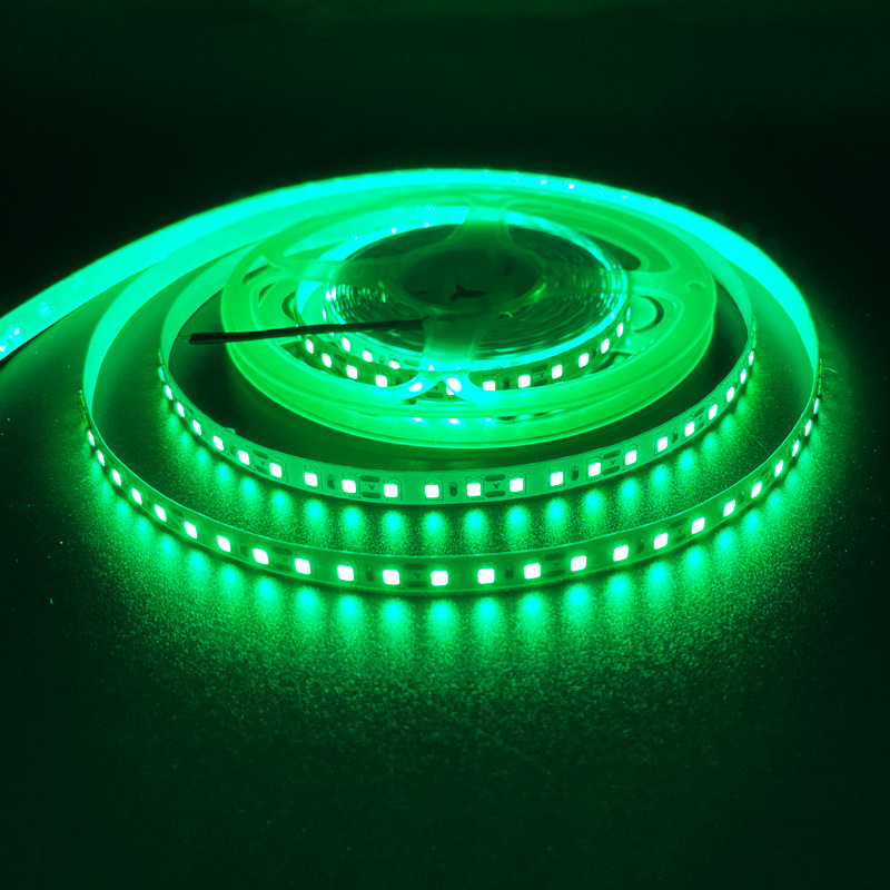 Green five-volt LED strip illuminated on a reel
